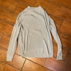 Cold shoulder mock neck sweater.